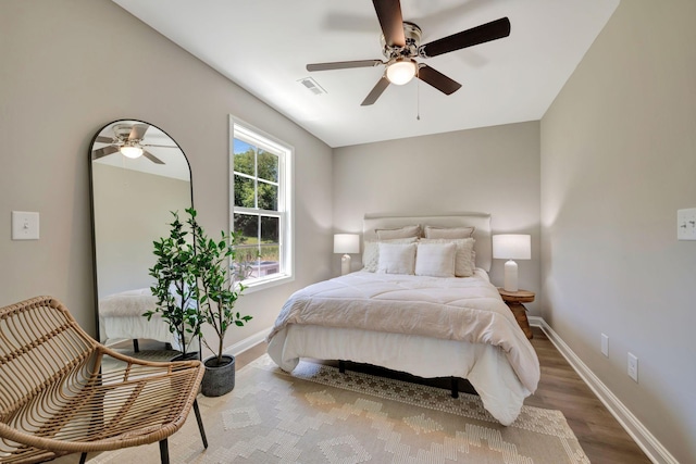 bedroom featuring ceiling fan and wood-type flooring