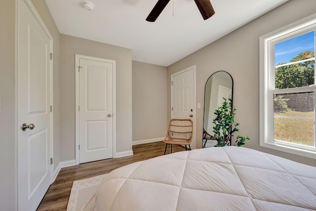 bedroom with ceiling fan and wood-type flooring