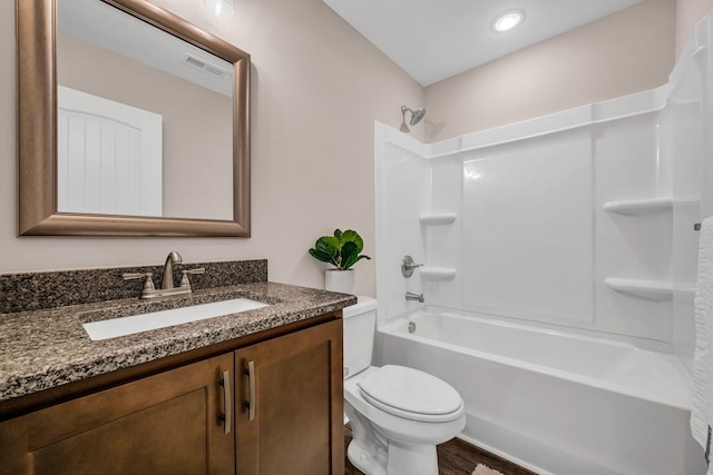 full bathroom featuring  shower combination, toilet, wood-type flooring, and vanity