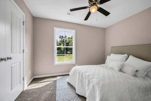 bedroom featuring ceiling fan and carpet