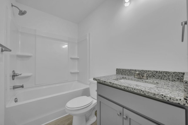 full bathroom featuring vanity, wood-type flooring, toilet, and shower / tub combination