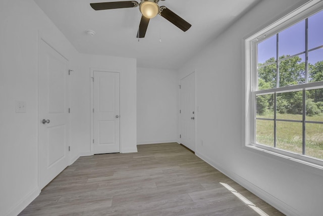 unfurnished room with light hardwood / wood-style flooring