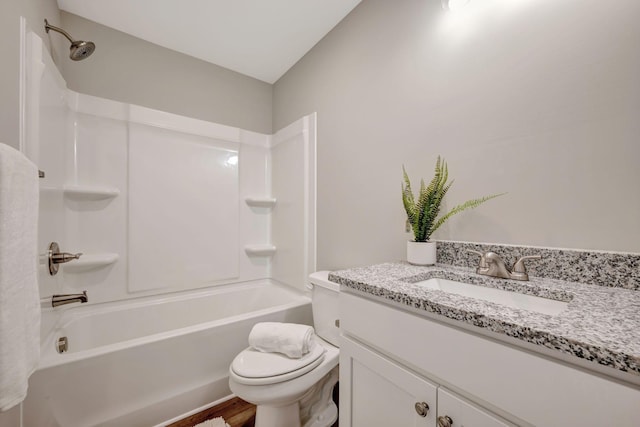 full bathroom featuring vanity, bathing tub / shower combination, and toilet