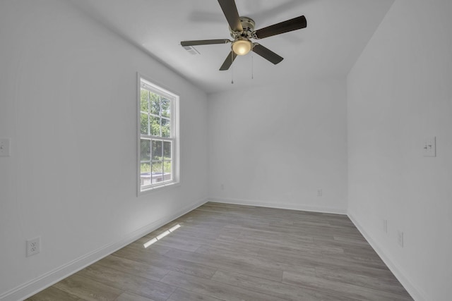 spare room with ceiling fan and light hardwood / wood-style flooring