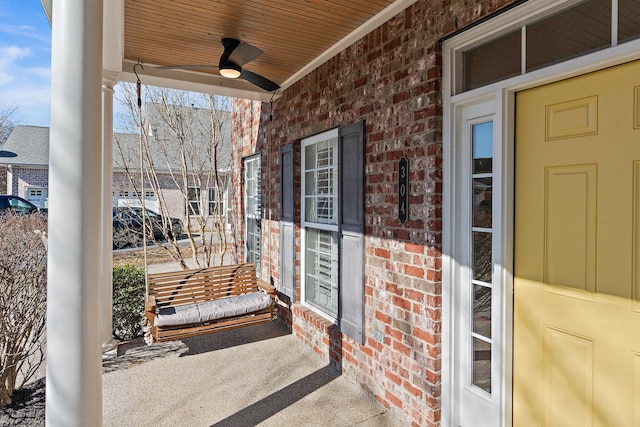 exterior space with ceiling fan