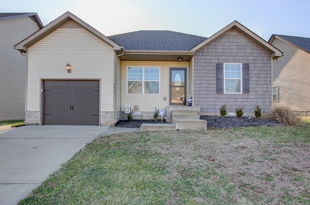 view of front of home featuring a garage and a front yard