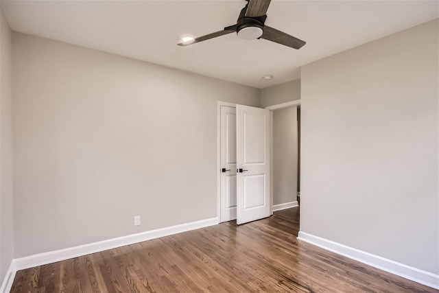 unfurnished bedroom featuring hardwood / wood-style floors and ceiling fan