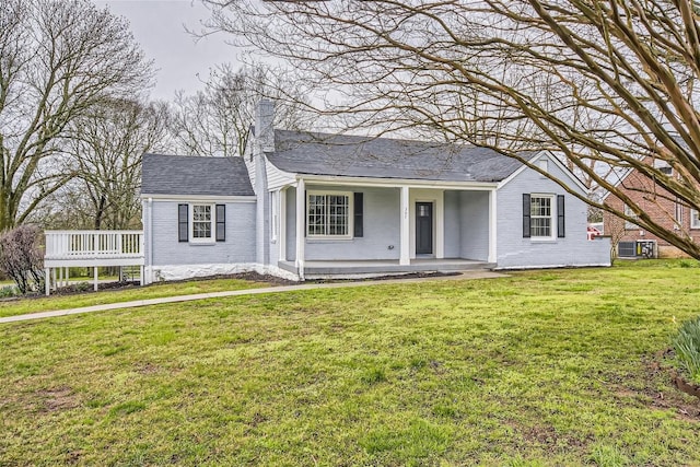 ranch-style house with central AC, a front yard, and covered porch