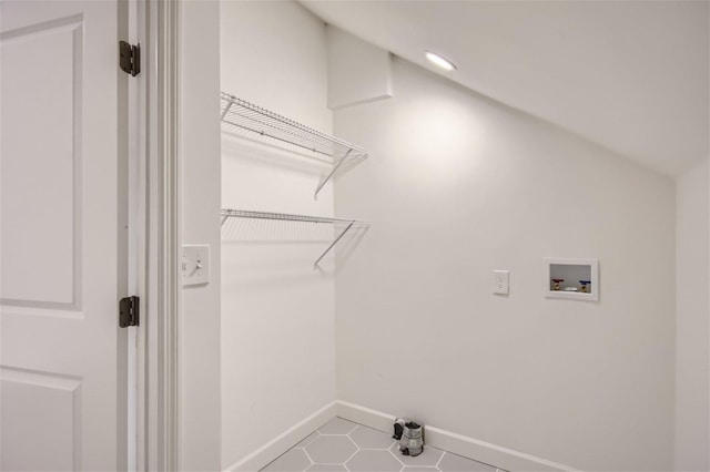 clothes washing area featuring washer hookup and tile patterned flooring