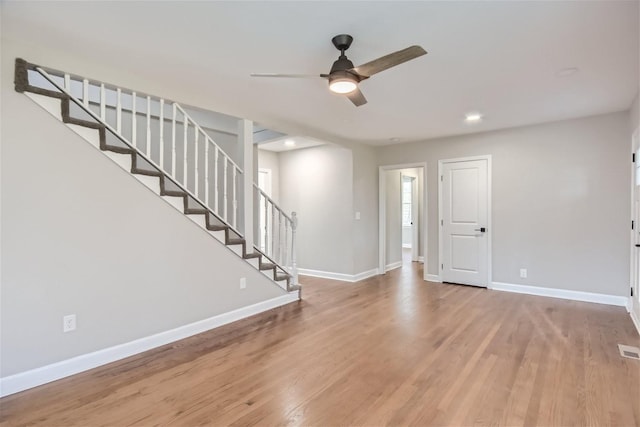 foyer entrance featuring ceiling fan and light wood-type flooring