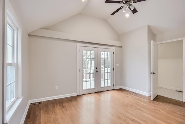 doorway with light hardwood / wood-style flooring, french doors, and a healthy amount of sunlight