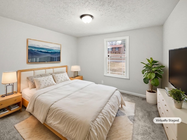 carpeted bedroom with a textured ceiling