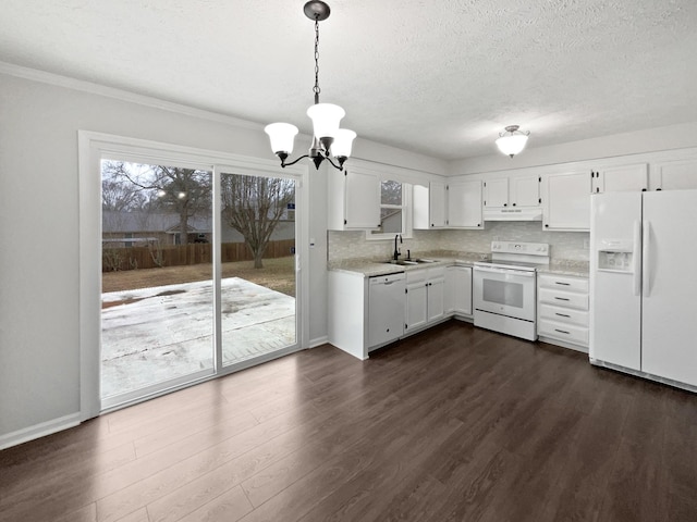 kitchen featuring sink, white appliances, white cabinetry, plenty of natural light, and decorative light fixtures