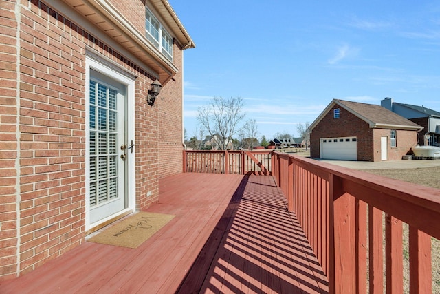 deck with a garage and an outdoor structure