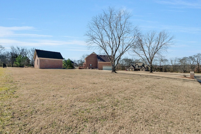 view of yard featuring a garage