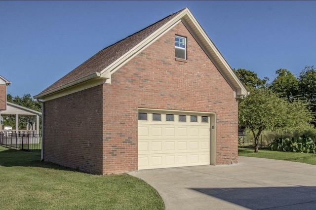 view of property exterior featuring a garage, an outdoor structure, and a lawn