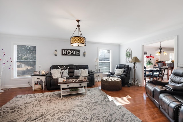 living room with hardwood / wood-style flooring and ornamental molding