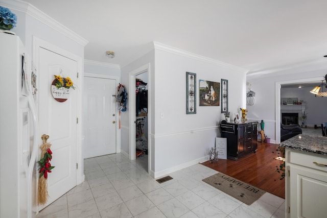 hall featuring ornamental molding