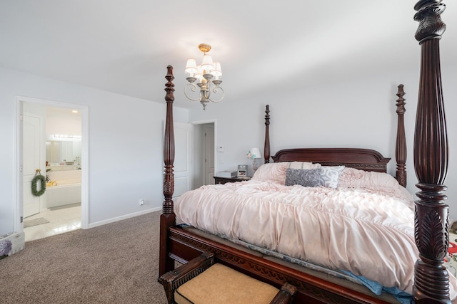 carpeted bedroom featuring connected bathroom and a notable chandelier