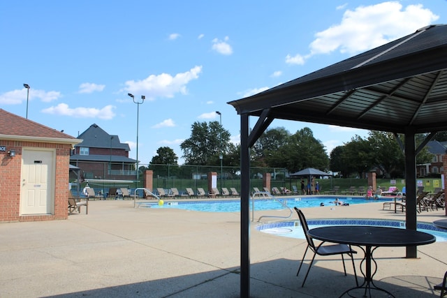 view of swimming pool with a gazebo and a patio area