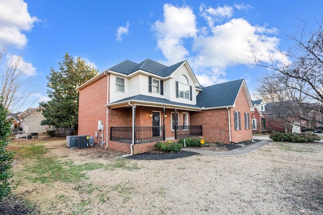 view of front of home featuring cooling unit and covered porch