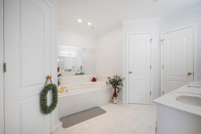 bathroom with crown molding, vanity, and a relaxing tiled tub