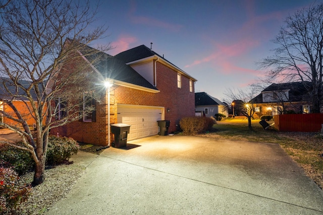 property exterior at dusk with a garage