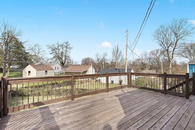 wooden terrace featuring an outbuilding