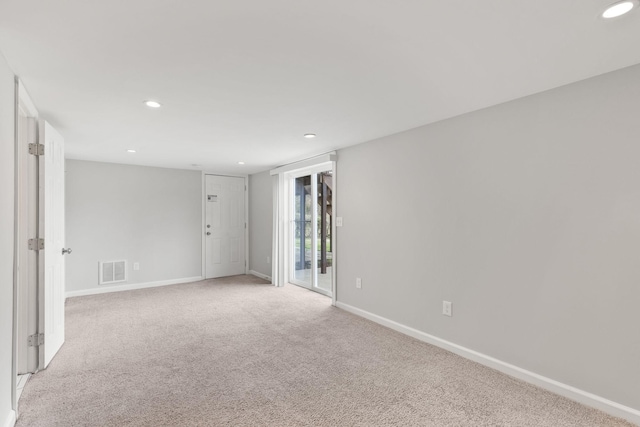 unfurnished room with light colored carpet