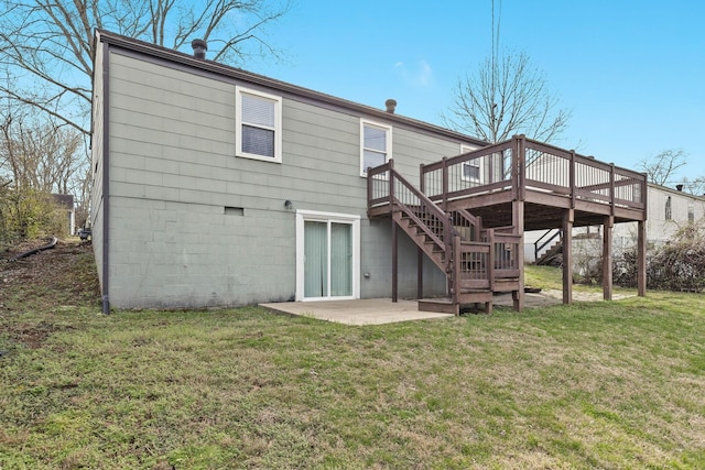 back of house with a yard, a deck, and a patio