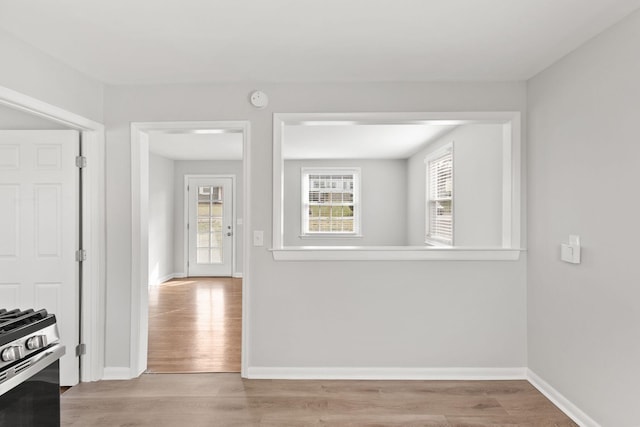 kitchen with gas range and light hardwood / wood-style floors