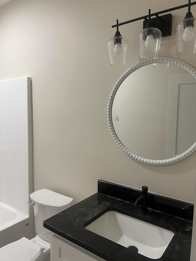 bathroom with vanity and toilet