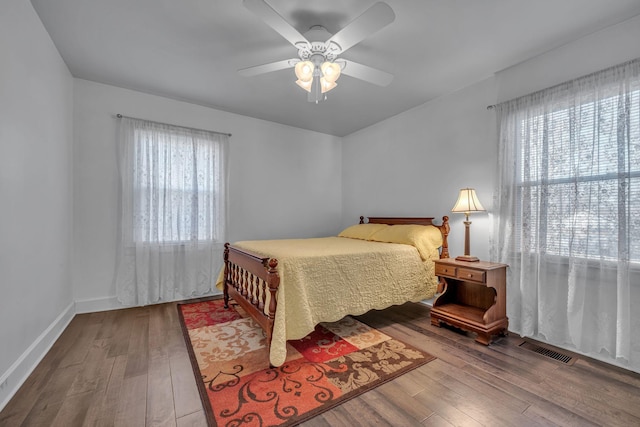 bedroom featuring ceiling fan and hardwood / wood-style floors