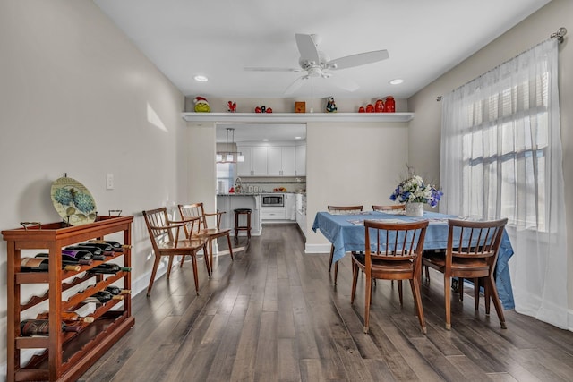 dining area featuring dark hardwood / wood-style floors and ceiling fan