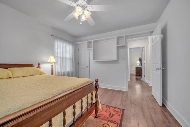 bedroom with ceiling fan and light wood-type flooring