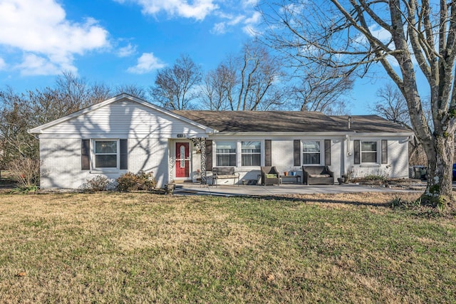 single story home with a patio area and a front yard