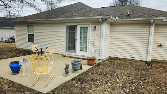 rear view of property featuring a patio area