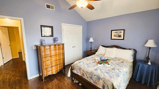 bedroom with dark hardwood / wood-style flooring, high vaulted ceiling, a closet, and ceiling fan