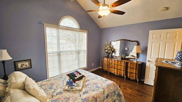 bedroom with dark wood-type flooring, ceiling fan, and vaulted ceiling