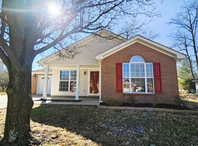 view of front facade featuring a garage and brick siding