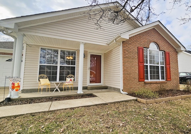 property entrance featuring covered porch