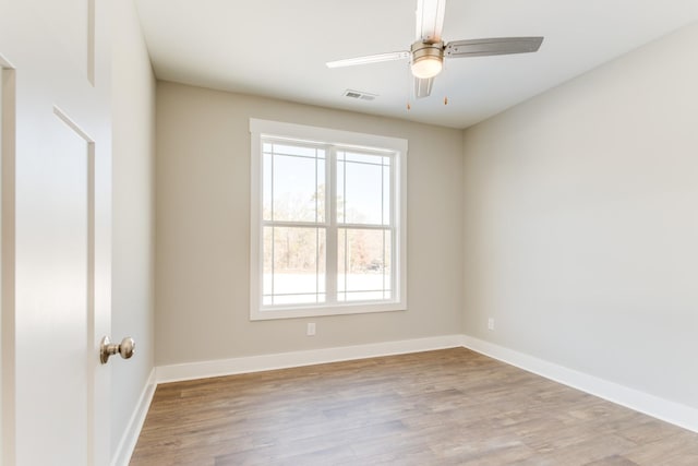 empty room featuring light hardwood / wood-style floors and ceiling fan