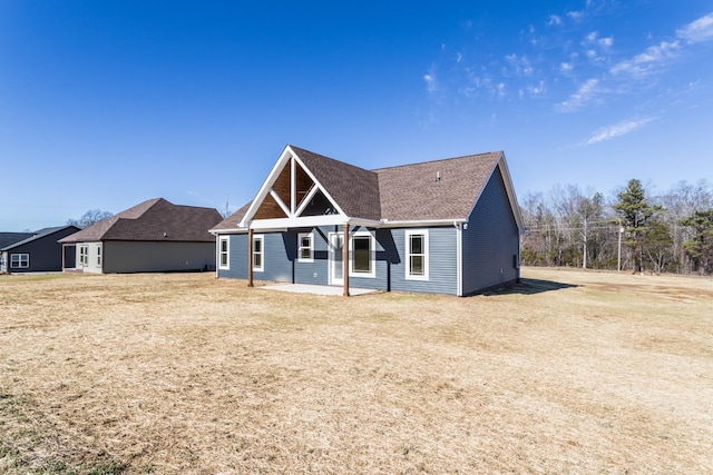 view of front of property with a patio area and a front yard