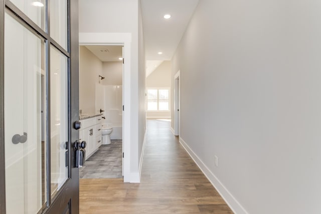 hallway featuring light hardwood / wood-style flooring