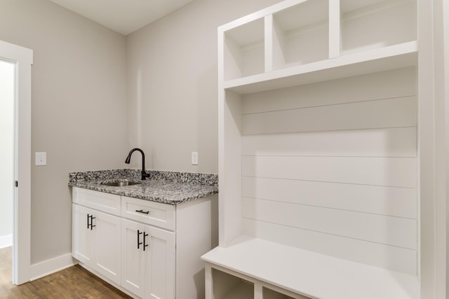 mudroom with hardwood / wood-style flooring and sink