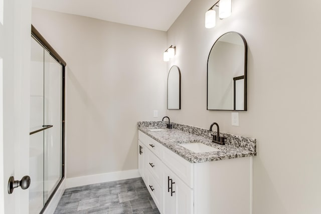 bathroom featuring vanity and walk in shower