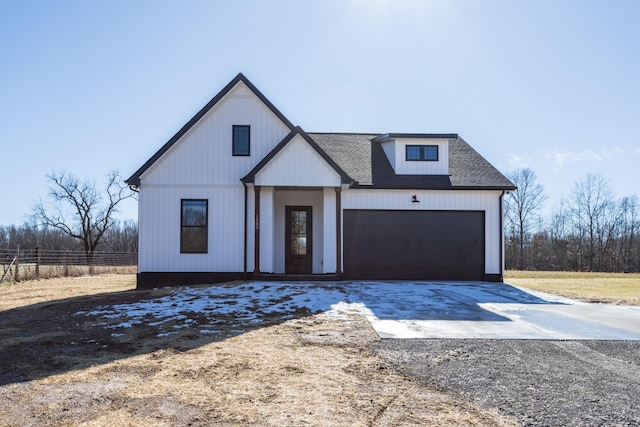 modern farmhouse featuring a garage