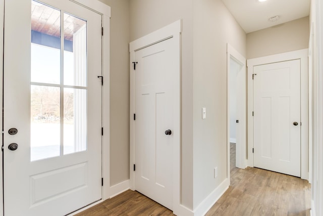 doorway to outside with light hardwood / wood-style flooring