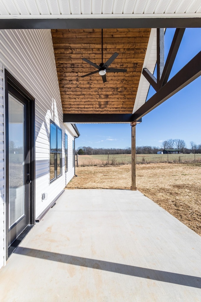 view of patio / terrace with a rural view and ceiling fan