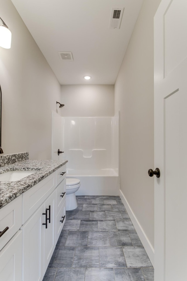 full bathroom with vanity, bathtub / shower combination, and toilet